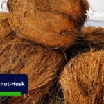 Coconut husks being processed into valuable coir fiber